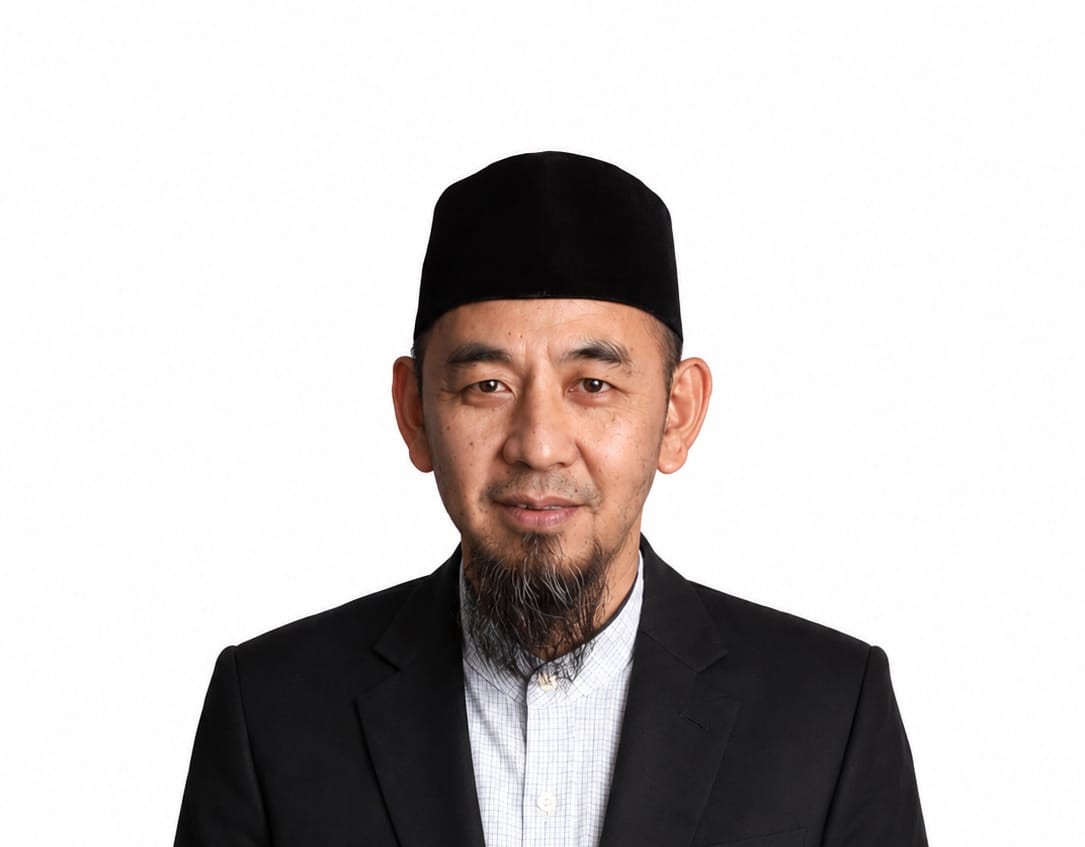 Dr. Qaharuddin Tahir, M.I.Kom.